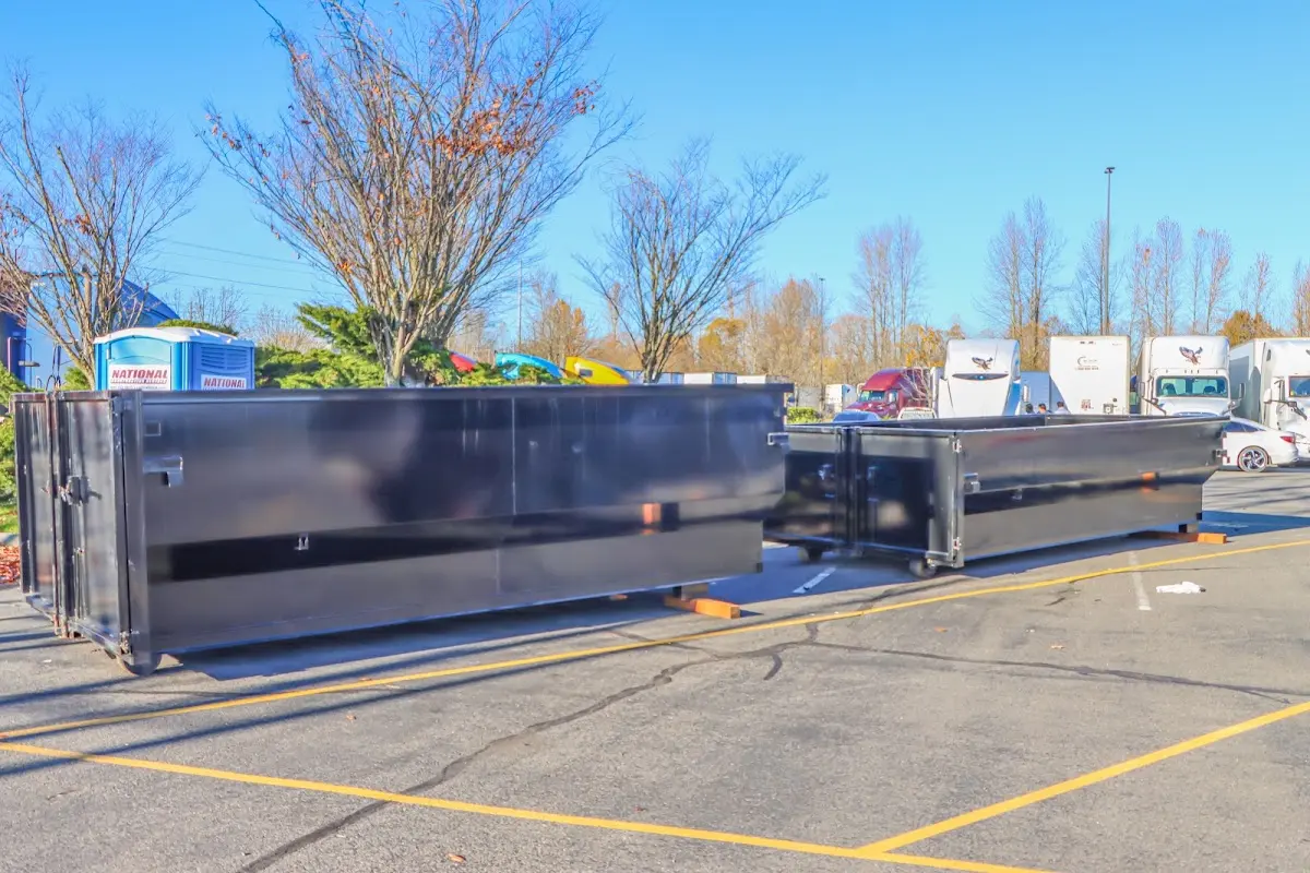 Professional dumpster rental service with roll-off container on residential driveway in Cicero